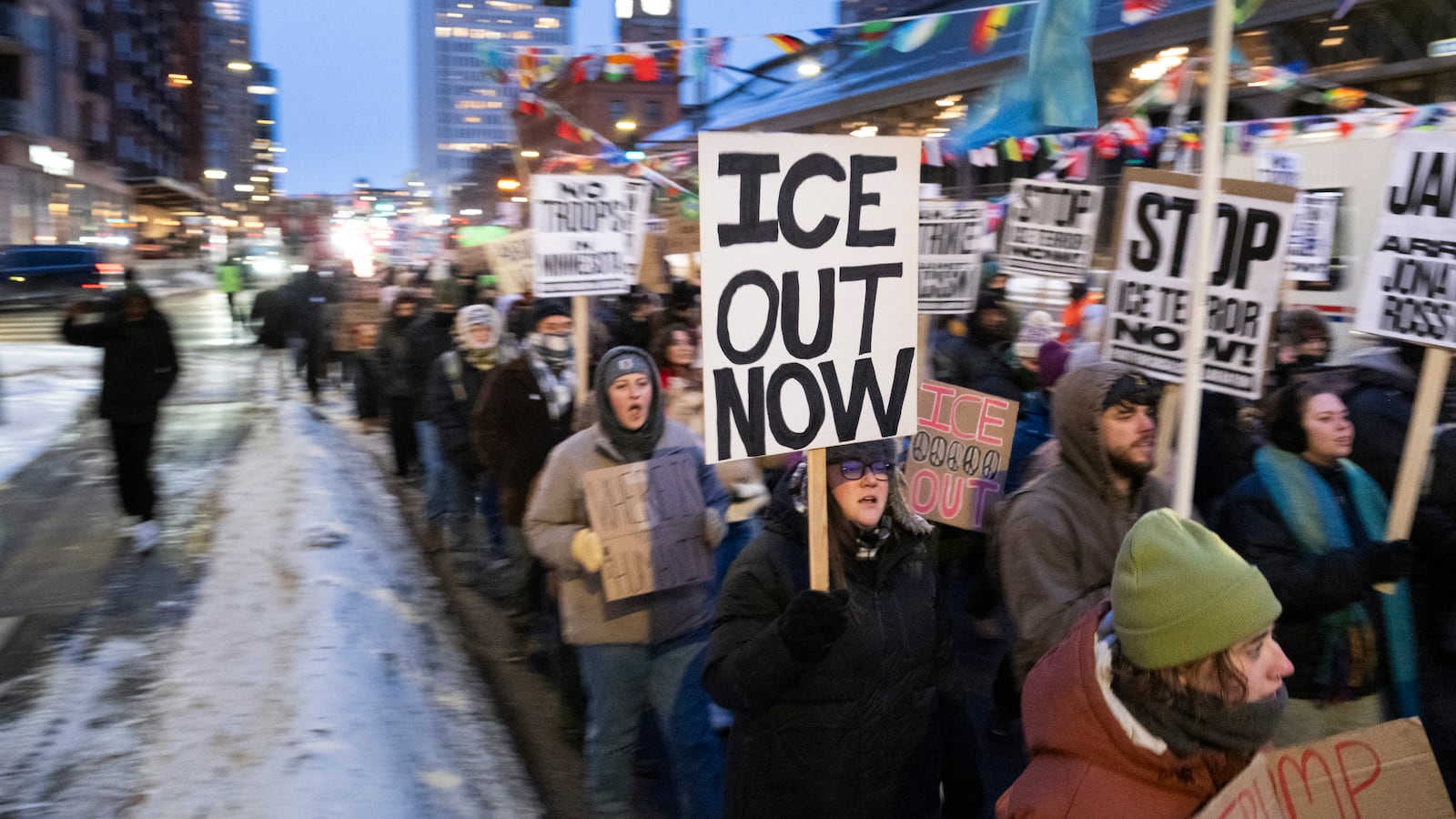 Demonstrators march during the nationwide "Stop ICE Terror" rally through downtown Minneapolis, Minnesota, on Jan. 20, 2026 in protest against US President Donald Trump's policies.