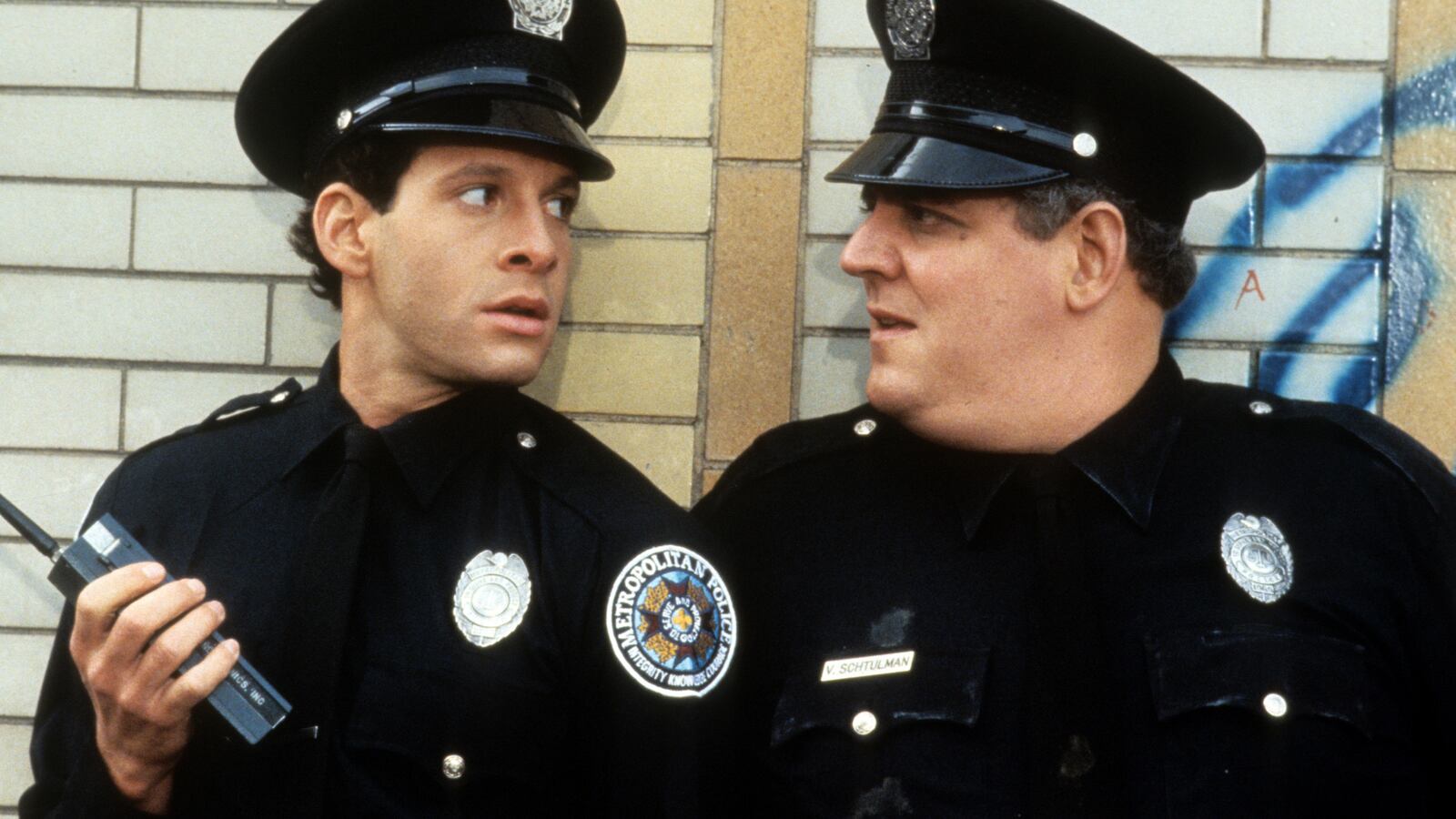 Steve Guttenberg looks to another cop in a scene from the film 'Police Academy 2