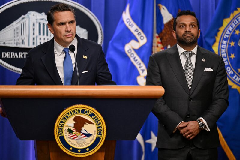 Acting U.S. Attorney General Todd Blanche speaks as Federal Bureau of Investigation (FBI) Director Kash Patel stands by his side during a press conference at the Department of Justice in Washington, D.C., U.S., April 21, 2026.