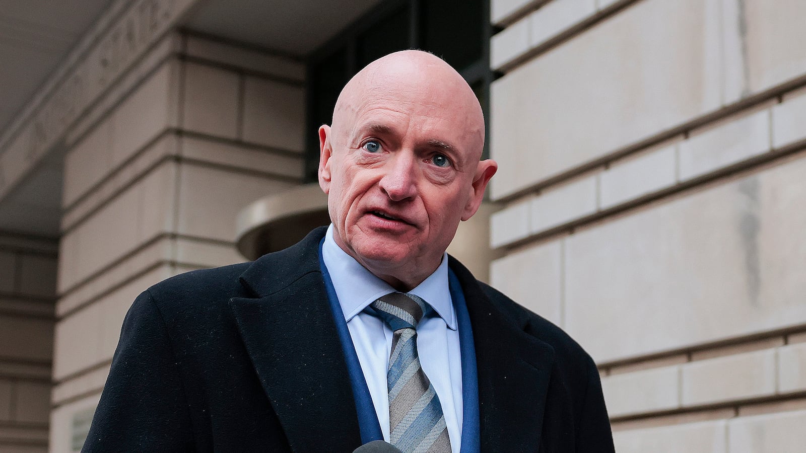 WASHINGTON, DC - FEBRUARY 03: Sen. Mark Kelly (D-AZ) speaks after departing federal court on February 03, 2026 in Washington, DC. Kelly is suing U.S. Secretary of War Pete Hegseth, asking a federal court to vacate the Pentagon chief's letter censuring the Arizona Democrat and moving to lower his military retirement rank. (Photo by Heather Diehl/Getty Images)