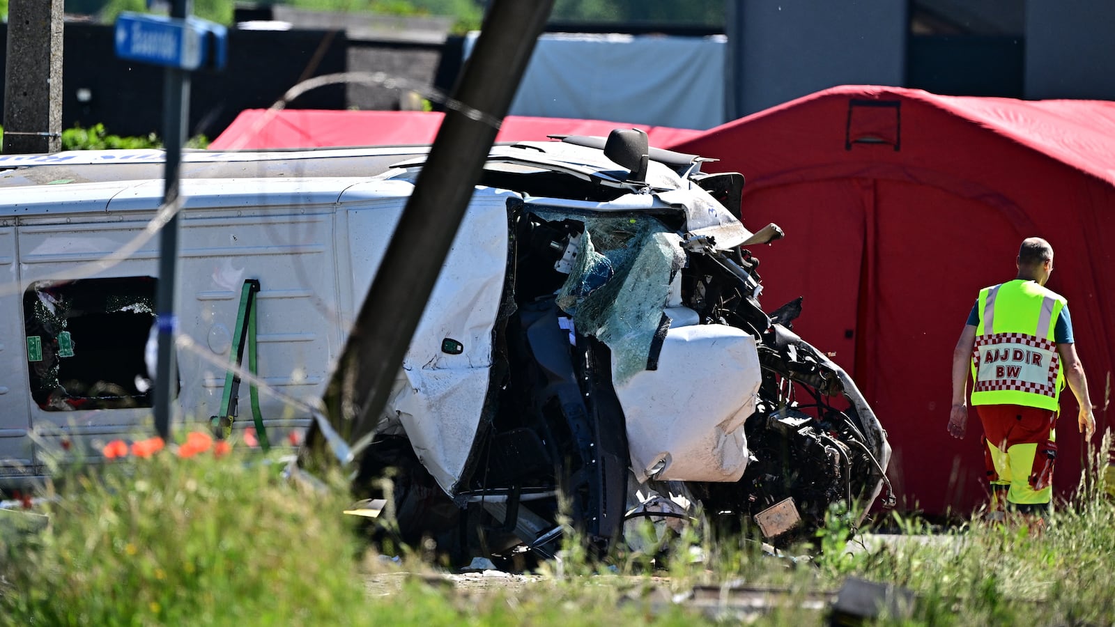 This photograph shows a damaged train car at the site of an accident after a train crashed into a school bus, at the railway crossing Vierhuizen in Buggenhout, some 20kms north of Brussels on May 26, 2026.