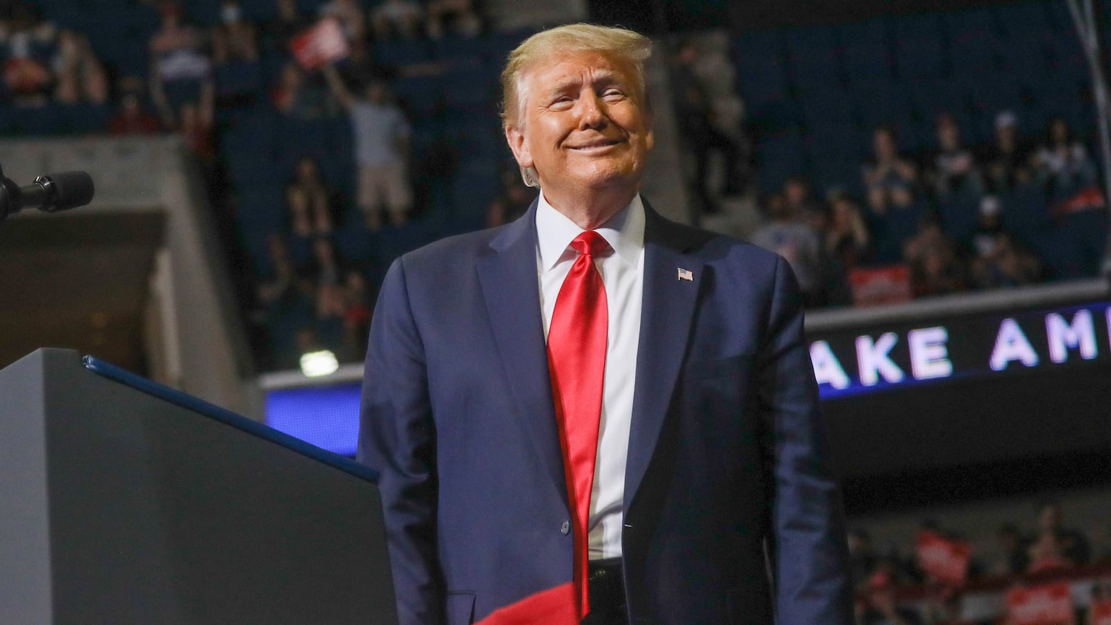 Donald Trump smiles at the crowd as he arrives at the podium at the BOK Center in Tulsa, Oklahoma, June 20, 2020.
