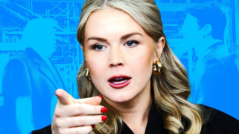 Karoline Leavitt standing in front of the CBS interview of Donald Trump