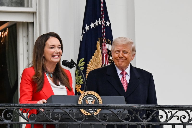 U.S. Agriculture Secretary Brooke Rollins speaks next to U.S. President Donald Trump during an event to give remarks to farmers on the South Lawn of the White House in Washington, D.C., U.S., March 27, 2026.