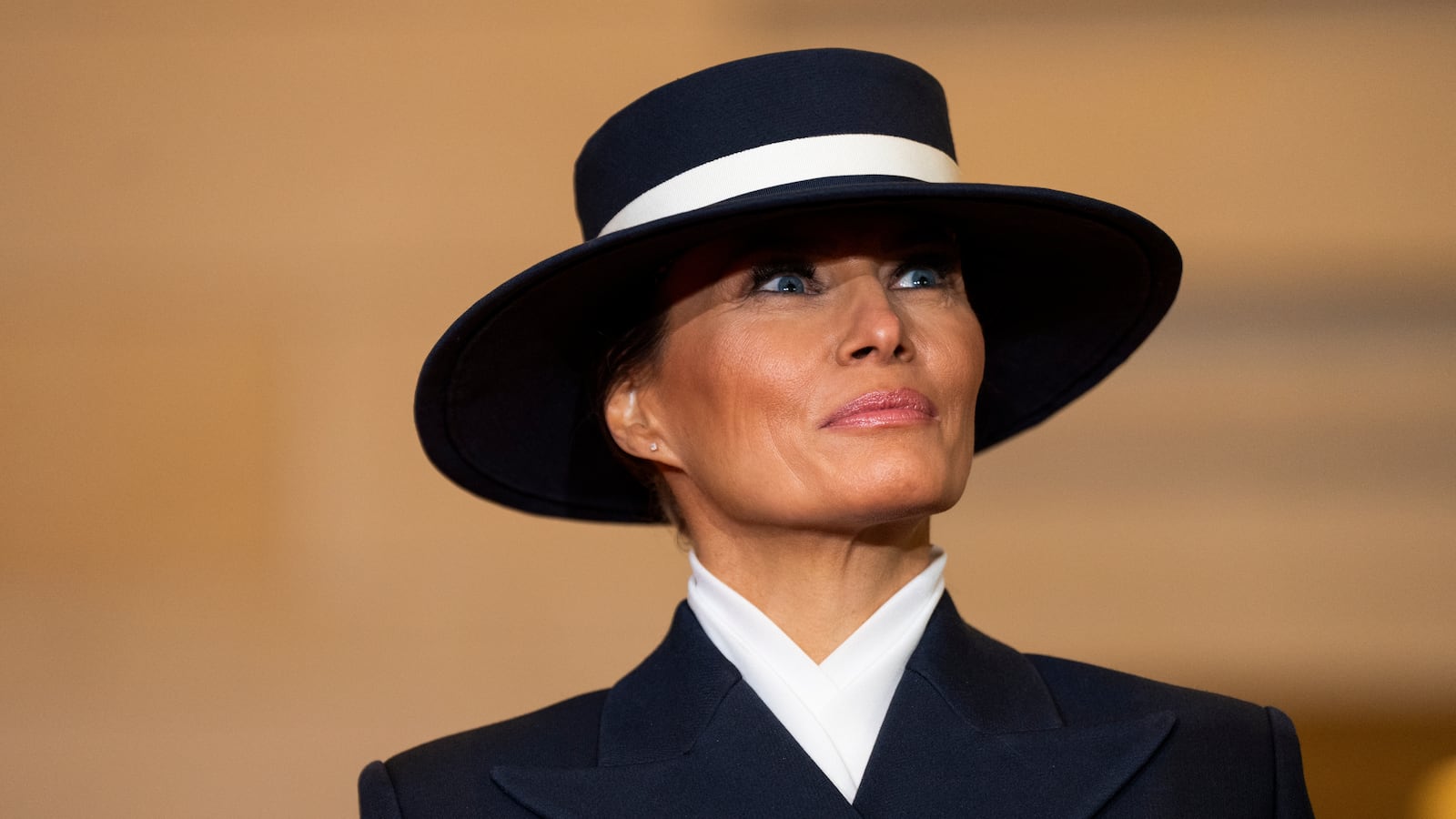 Melania Trump at Trump's inauguration with large hat.