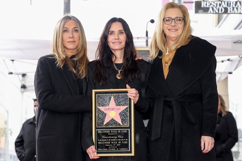 Actors Courteney Cox, Jennifer Aniston, and Lisa Kudrow pose during Courteney Cox's star unveiling ceremony on the Hollywood Walk of Fame in Los Angeles, California, U.S., February 27, 2023.