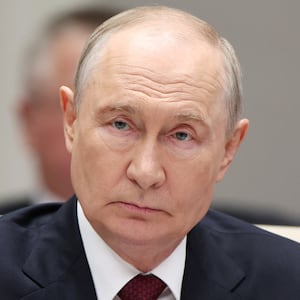Russian President Vladimir Putin attends a session