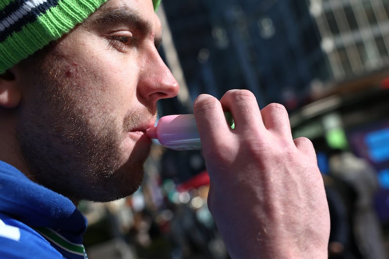 NEW YORK, NEW YORK - DECEMBER 02: A person uses a vape pen near Bryant Park on December 02, 2024 in New York City. The Supreme Court began to hear arguments on the Food and Drug Administration, refusal to approve flavored e-cigarettes over public health concerns. (Photo by Michael M. Santiago/Getty Images)