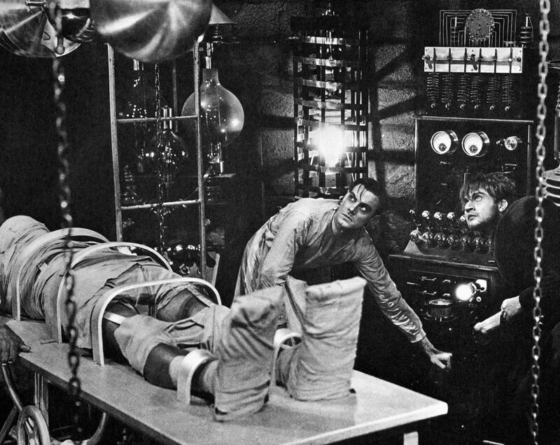 Colin Clive, as Dr. Frankenstein, and Dwight Frye, as his assistant Fritz, prepare to bring their monster to life in a scene from the 1931 movie version of Mary Shelley's Frankenstein.