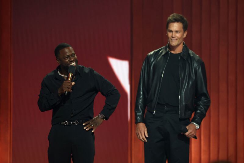 Kevin Hart and Tom Brady speak onstage during Netflix Is A Joke Festival Presents: The Roast of Kevin Hart at The Kia Forum on May 10, 2026, in Inglewood, California.