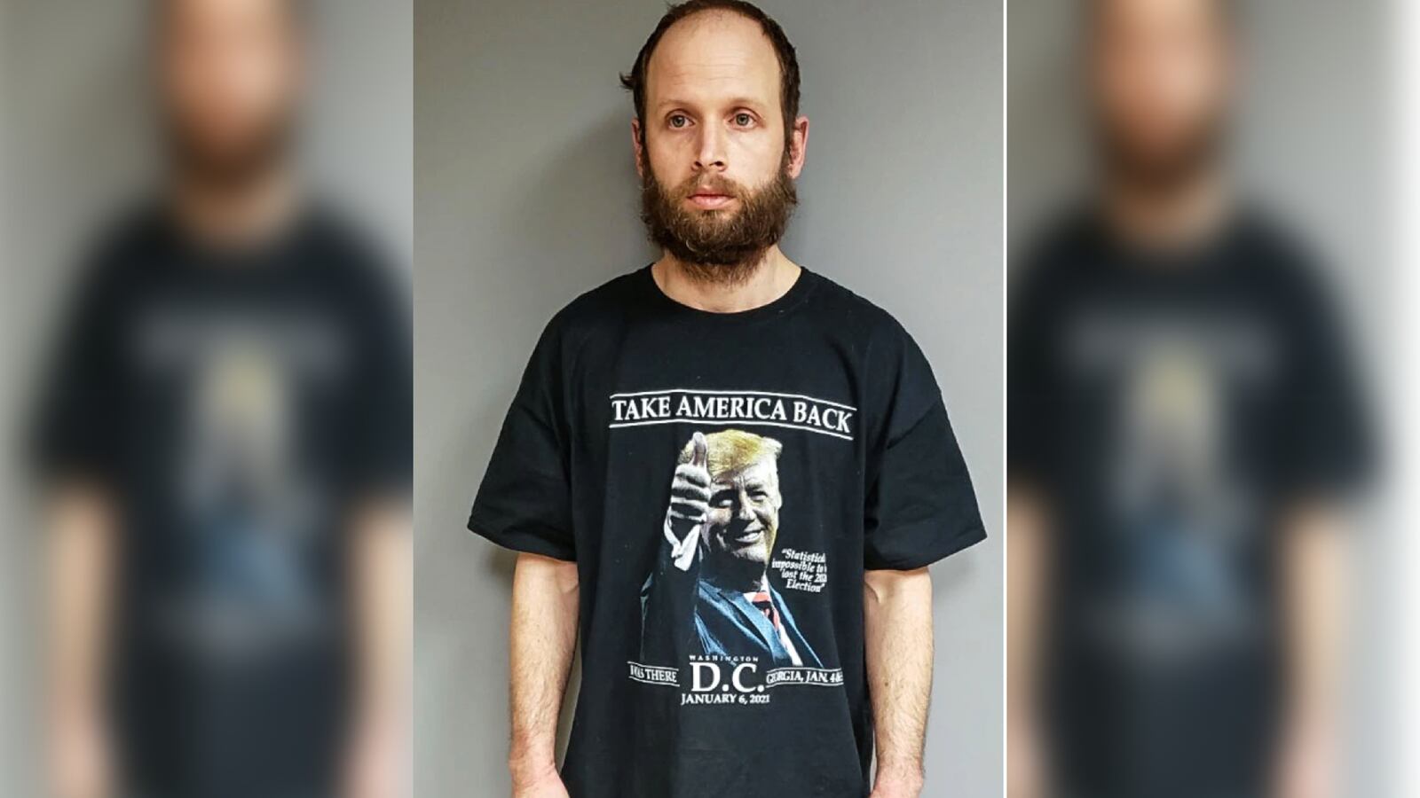 Garret Miller's mugshot showing him in a Trump shirt that says “I was there, Washington, D.C., January 6, 2021”