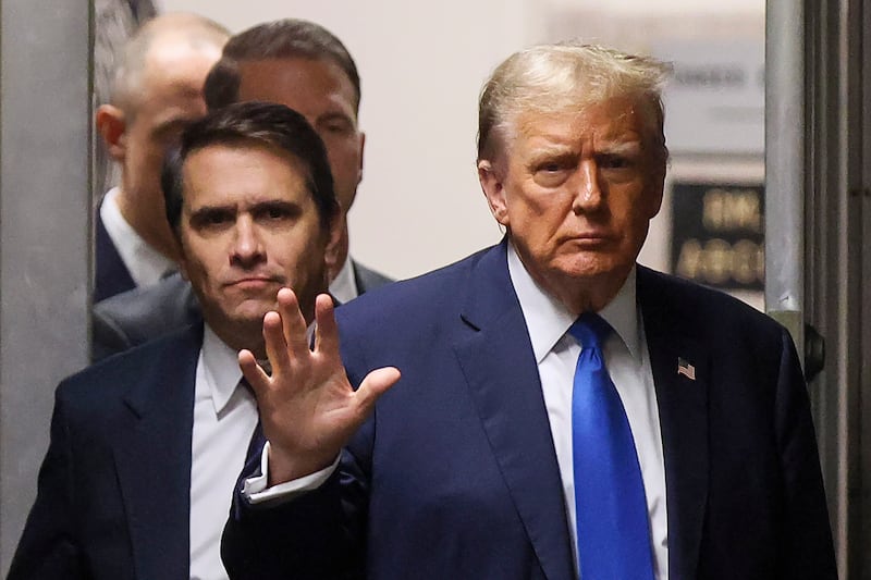 NEW YORK, NEW YORK - APRIL 18: Former U.S. President Donald Trump waves as he returns to the courtroom with attorney Todd Blanche during a recess in his criminal trial as jury selection continues at Manhattan Criminal Court on April 18, 2024 in New York City. Trump was charged with 34 counts of falsifying business records last year, which prosecutors say was an effort to hide a potential sex scandal, both before and after the 2016 presidential election. Trump is the first former U.S. president to face trial on criminal charges. (Photo by Brendan McDermid-Pool/Getty Images)