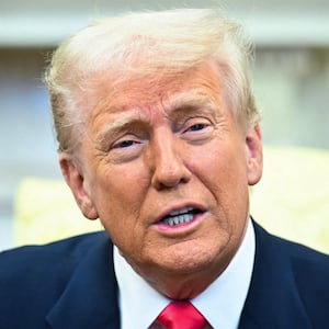 US President Donald Trump speaks to reporters.