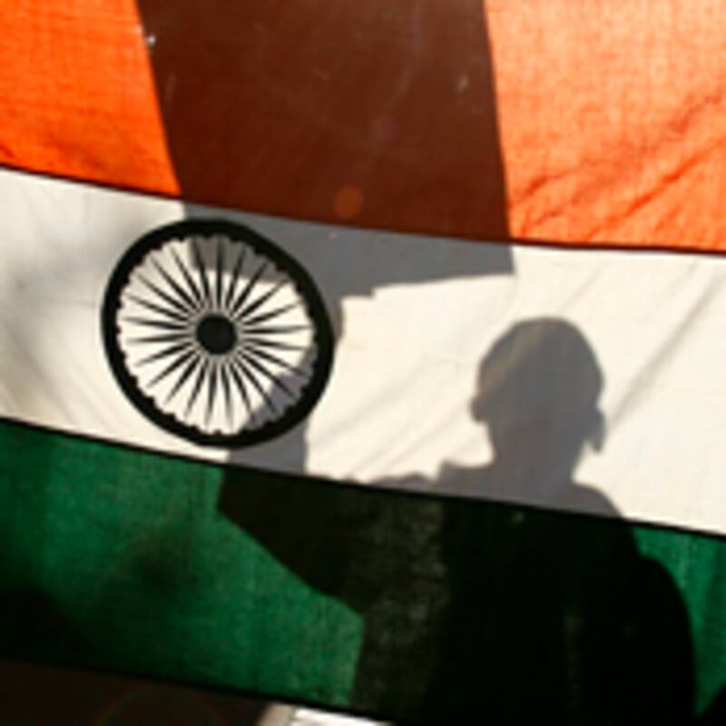articles/2009/06/10/half-blinded-by-india/adiga-behind-the-book-indian-flag_31211_iymrjl