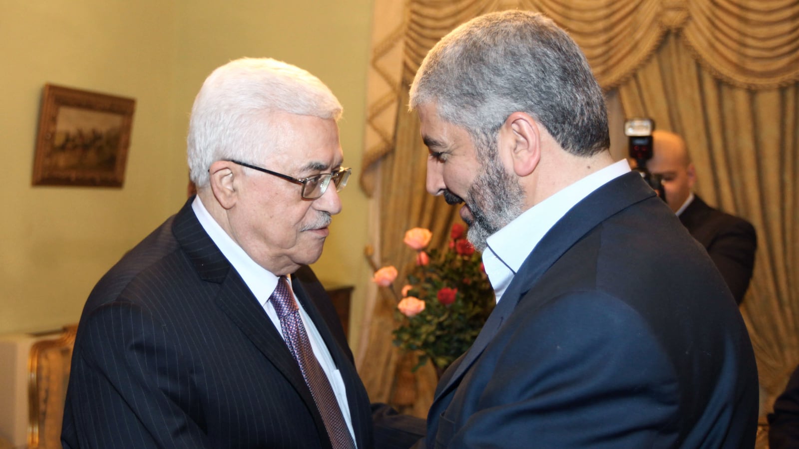 articles/2012/04/04/unify-the-palestinians-neutralize-hamas/abbas-meshal-hand-shake-openz_ajldqq