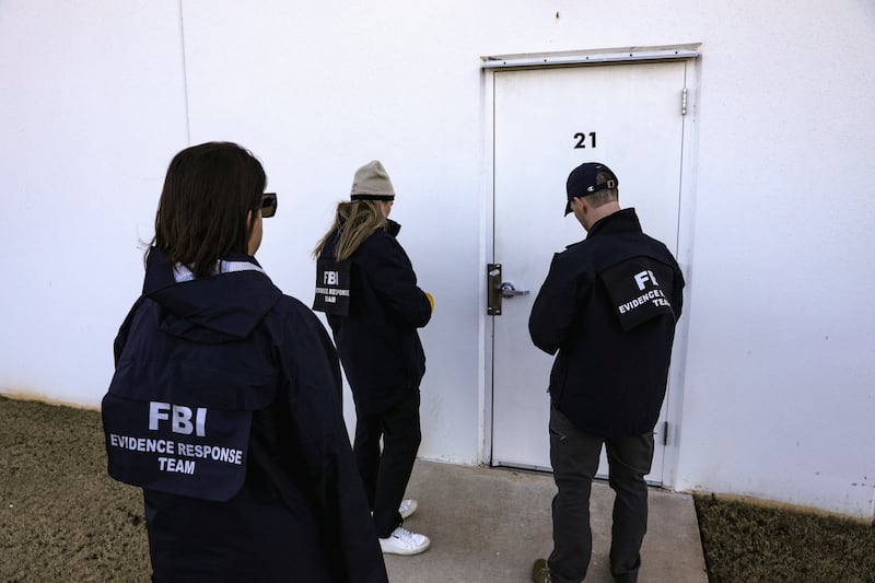 Members of the Federal Bureau of Investigation (FBI) Evidence Response Team prepare to enter the Fulton County Election Hub and Operation Center after the FBI executed a search warrant there in relation to the 2020 election, according to a law enforcement official familiar with the matter, in Union City, Georgia, U.S. January 28, 2026.  REUTERS/Alyssa Pointer