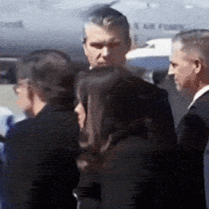 Defense Secretary Pete Hegseth chewing a mystery substance after landing in Delaware with President Donald Trump to attend the dignified transfer ceremony for six troops killed in the Iran War on March 18, 2026.
