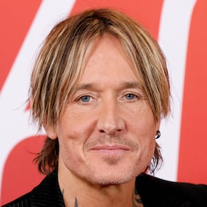 Keith Urban covered Chappell Roan's "Pink Pony Club" at Mar-a-Lago, with President Trump in attendance, angering some of Roan's fans.