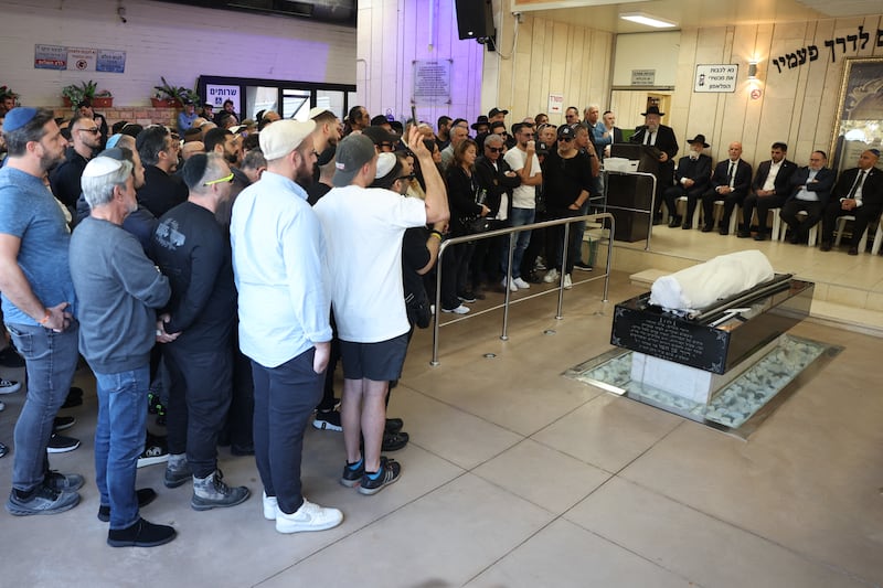 Relatives and friends of Dan Elkayam, 27, a French Jewish engineer from Le Bourget, who was killed in the terrorist attack that struck Bondi Beach in Australia on December 14, during the Jewish holiday of Hanukkah, mourn his coffin.