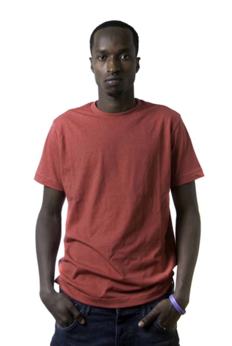 galleries/2012/03/05/congolese-refugee-portraits-photos/congolese-refugees-orange-tee_edftt8