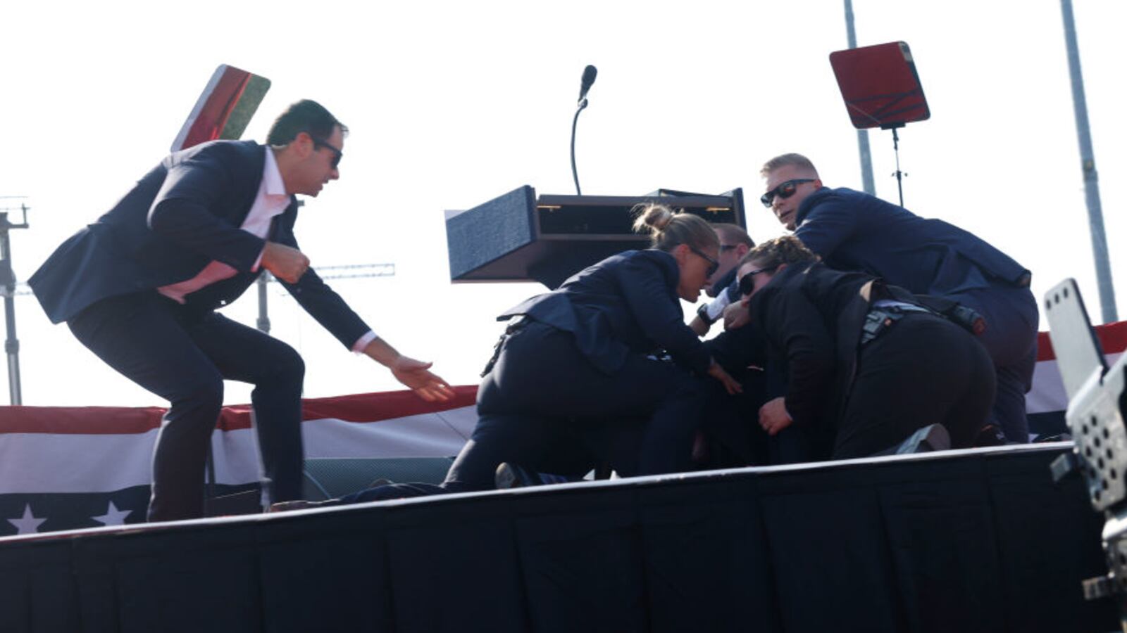 Former President Donald Trump is rushed offstage during a rally on July 13, 2024 in Butler, Pennsylvania.