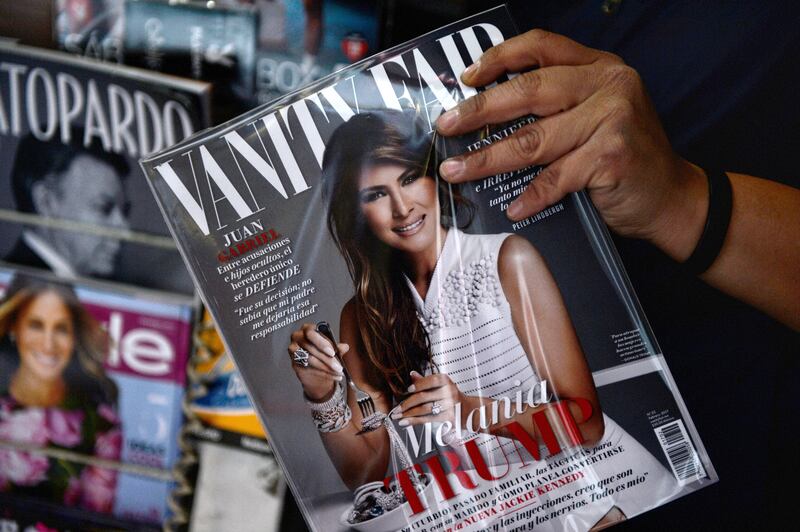 A newspaper vendor shows the February 2017 issue of the Mexican edition of Vanity Fair with the US first lady Melania Trump in the cover, at their stand in Mexico City on January 30, 2017. Vanity Fair's Mexican edition provoked social media outrage Friday after releasing a preview of its February cover featuring America's first lady, as US-Mexico relations worsened over Donald Trump's border wall plans. (Photo by PEDRO PARDO / AFP) (Photo by PEDRO PARDO/AFP via Getty Images)