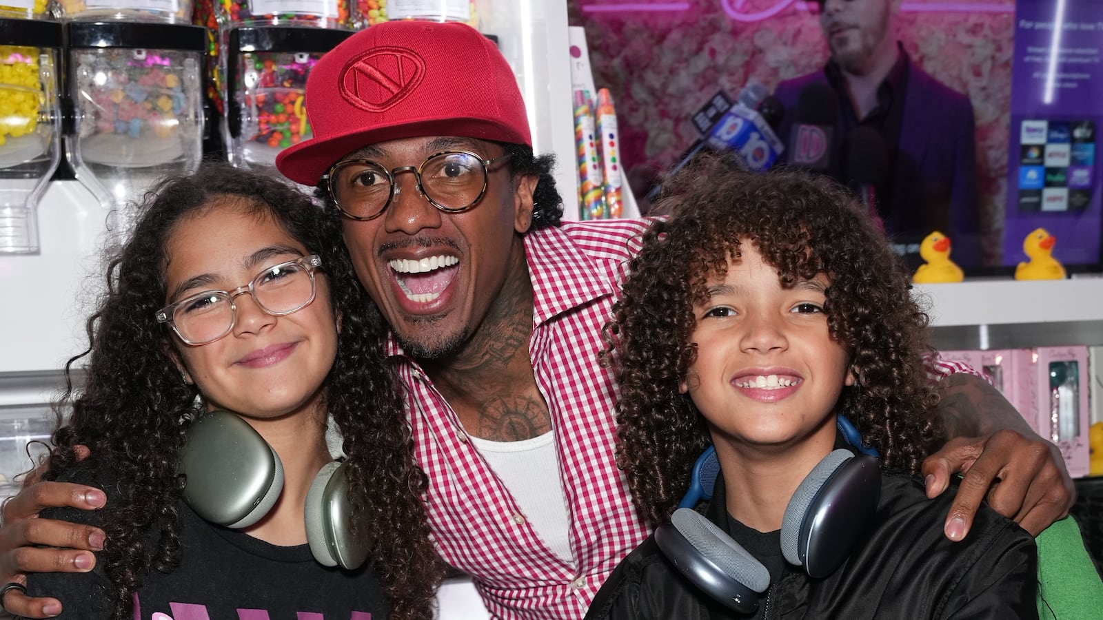 NEW YORK, NEW YORK - AUGUST 11: Moroccan Cannon, Nick Cannon and Monroe Cannon attend the Natti Natasha & Nick Cannon host Sugar Factory in Times Square on August 11, 2023 in New York City.
