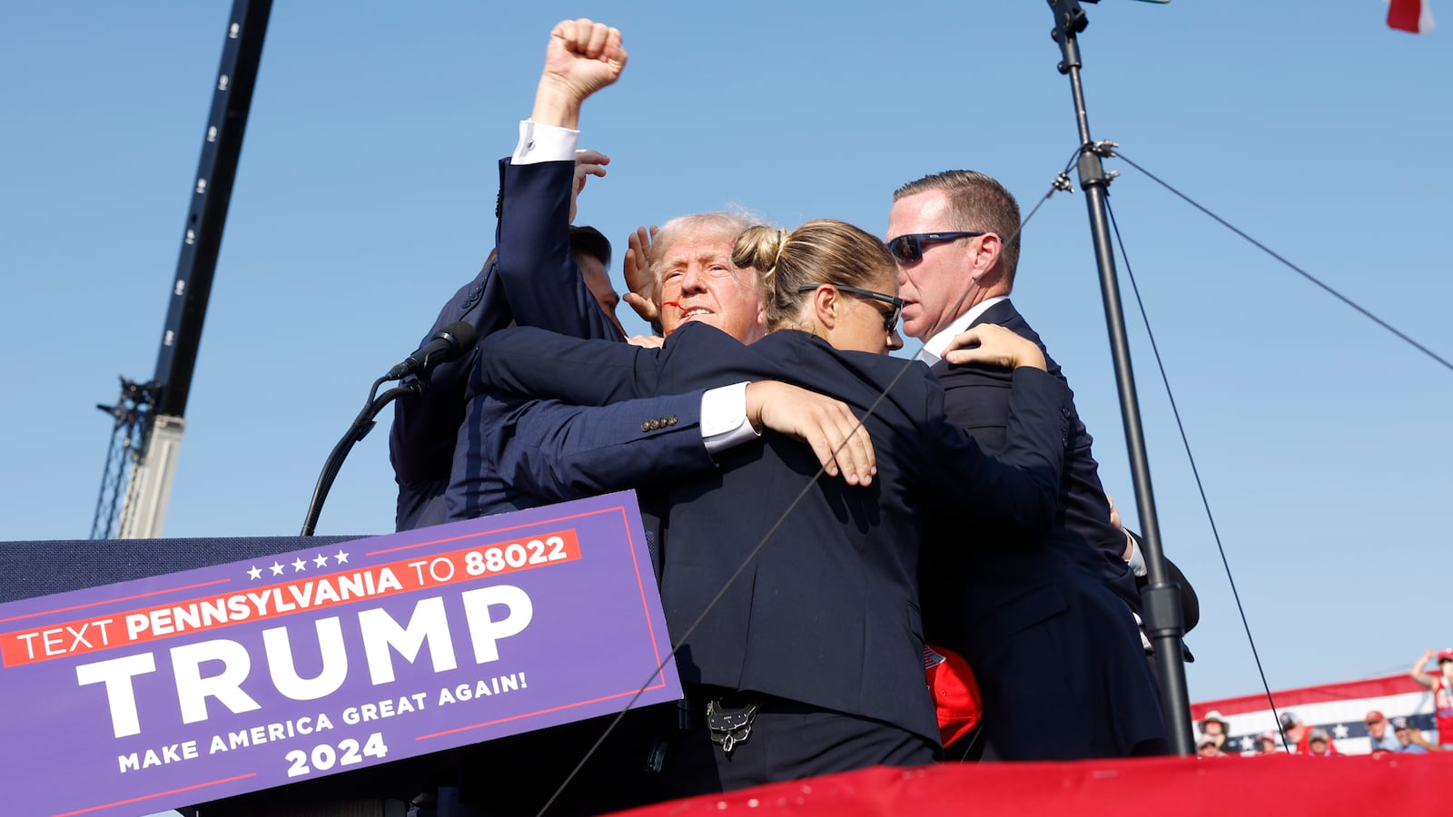 Republican presidential candidate former President Donald Trump is rushed offstage during a rally on July 13, 2024 in Butler, Pennsylvania.