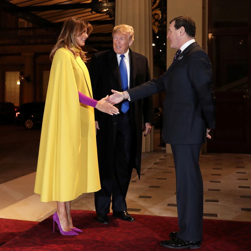 U.S. President Donald Trump and his wife first lady Melania Trump are greeted by Deputy Master of The Household Lt Col Anthony Charles Richards as they arrive at Buckingham Palace for a reception to mark 70 years of the NATO Alliance, hosted by Britain's Queen Elizabeth, in London, Britain, December 3, 2019.