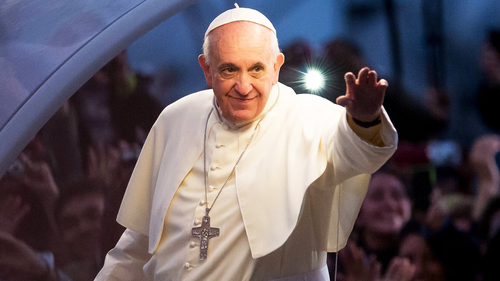 Pope Francis waves from the Popemobile on his way to attend the Via Crucis on Copacabana Beach during World Youth Day celebrations on July 26, 2013 in Rio de Janeiro, Brazil. More than 1.5 million pilgrims are expected to join the pontiff for his visit to the Catholic Church's World Youth Day celebrations which is running July 23-28.