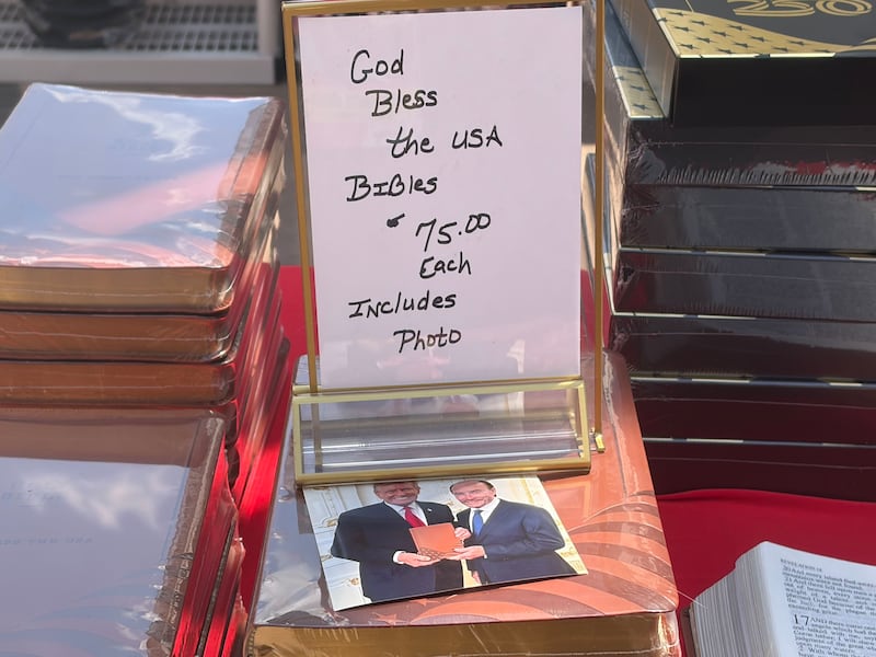 Bibles with a picture of Trump for sale outside the GOP midterm convention.