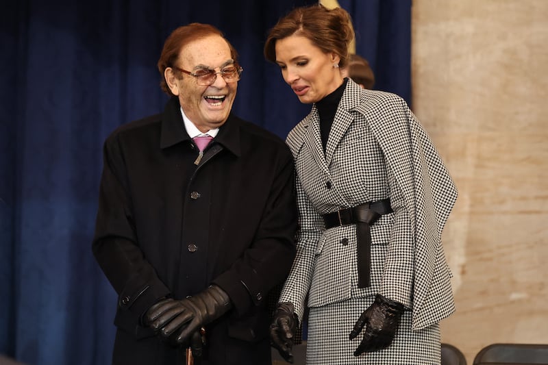 Treasure Island Hotel and Casino and Circus Circus Hotel & Casino in Las Vegas owner Phil Ruffin and his wife Oleksandra Nikolayenko attend the inauguration of US President-elect Donald Trump in the Rotunda of the US Capitol on January 20, 2025 in Washington, DC.