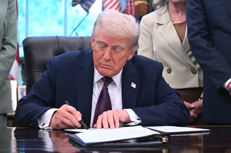 US President Donald Trump signs an order sending National Guard to Memphis, in the Oval Office of the White House in Washington, DC, on September 15, 2025. US President Donald Trump said on September 15 he was signing an order sending a federal "task force" including National Guard troops to the city of Memphis, in the latest stage of his crime crackdown that critics have branded authoritarian.
"The effort will include the National Guard as well as the FBI" and other federal agencies, Trump told reporters at a signing ceremony in the Oval Office, adding that it was "very important because of the crime that's going on." (Photo by SAUL LOEB / AFP) (Photo by SAUL LOEB/AFP via Getty Images)