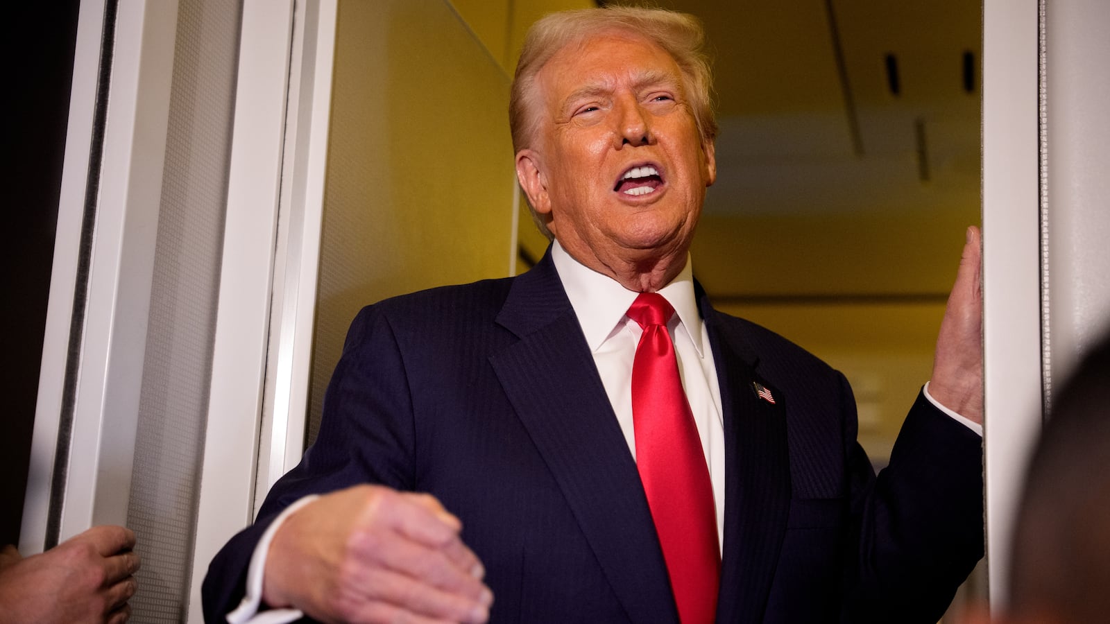 President Donald Trump speaks to members of the media aboard Air Force One on October 30, 2025 in flight.