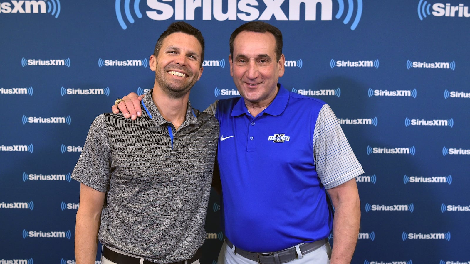 DURHAM, NC - MAY 31: Duke basketball head coach Mike Krzyzewski (R) and SiriusXM host Chris Spatola pose for a photo during SiriusXM's Town Hall With Hall Of Fame Coach Mike Krzyzewski at Bill Brill Media Room in Cameron Indoor Stadium on May 31, 2018 in Durham, North Carolina. (Photo by Lance King/Getty Images for SiriusXM)