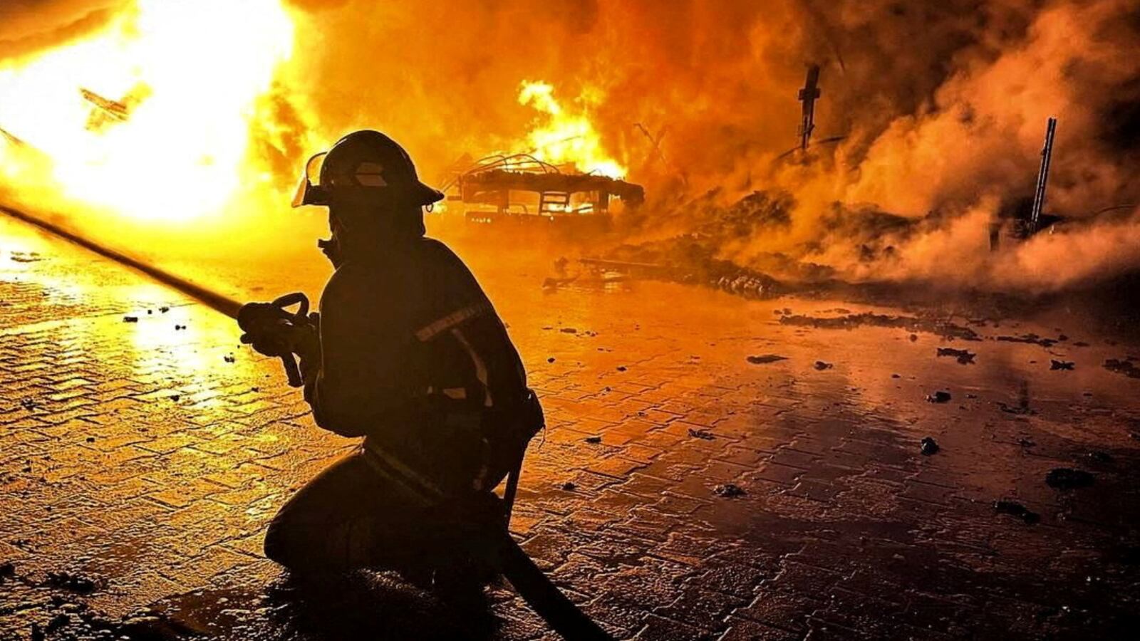 A firefighter works at a compound of a port on Danube river damaged by a Russian drone strike, amid Russia's attack on Ukraine.