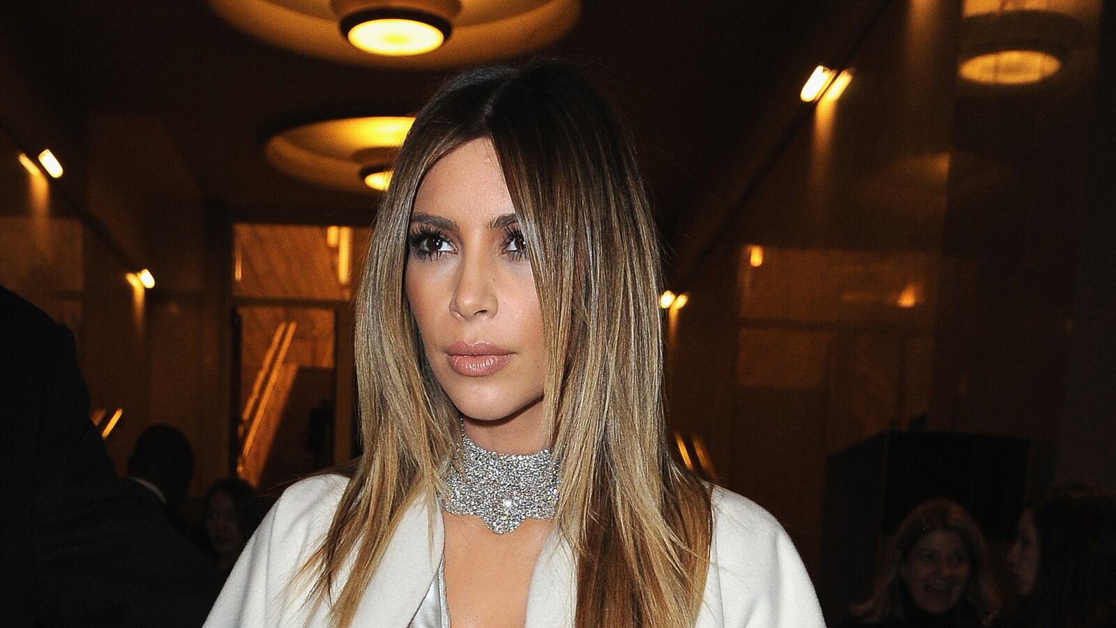 articles/2014/01/22/kim-kardashian-s-5k-a-day-booty-tailor-donatella-versace-gifts-couture-crystal-headpiece-to-lady-gaga/140122-kim-fashion-cheat_xq8zpj