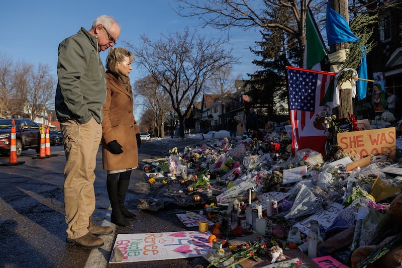 MINNEAPOLIS, UNITED STATES - JANUARY 12: Minnesota Governor Tim Walz and his wife, Gwen Walz, visit a makeshift memorial for 37-year-old Renee Good, who was shot and killed by a federal immigration agent in Minneapolis, Minnesota, United States, on January 12, 2026. (Photo by Madison Thorn/Anadolu via Getty Images)
