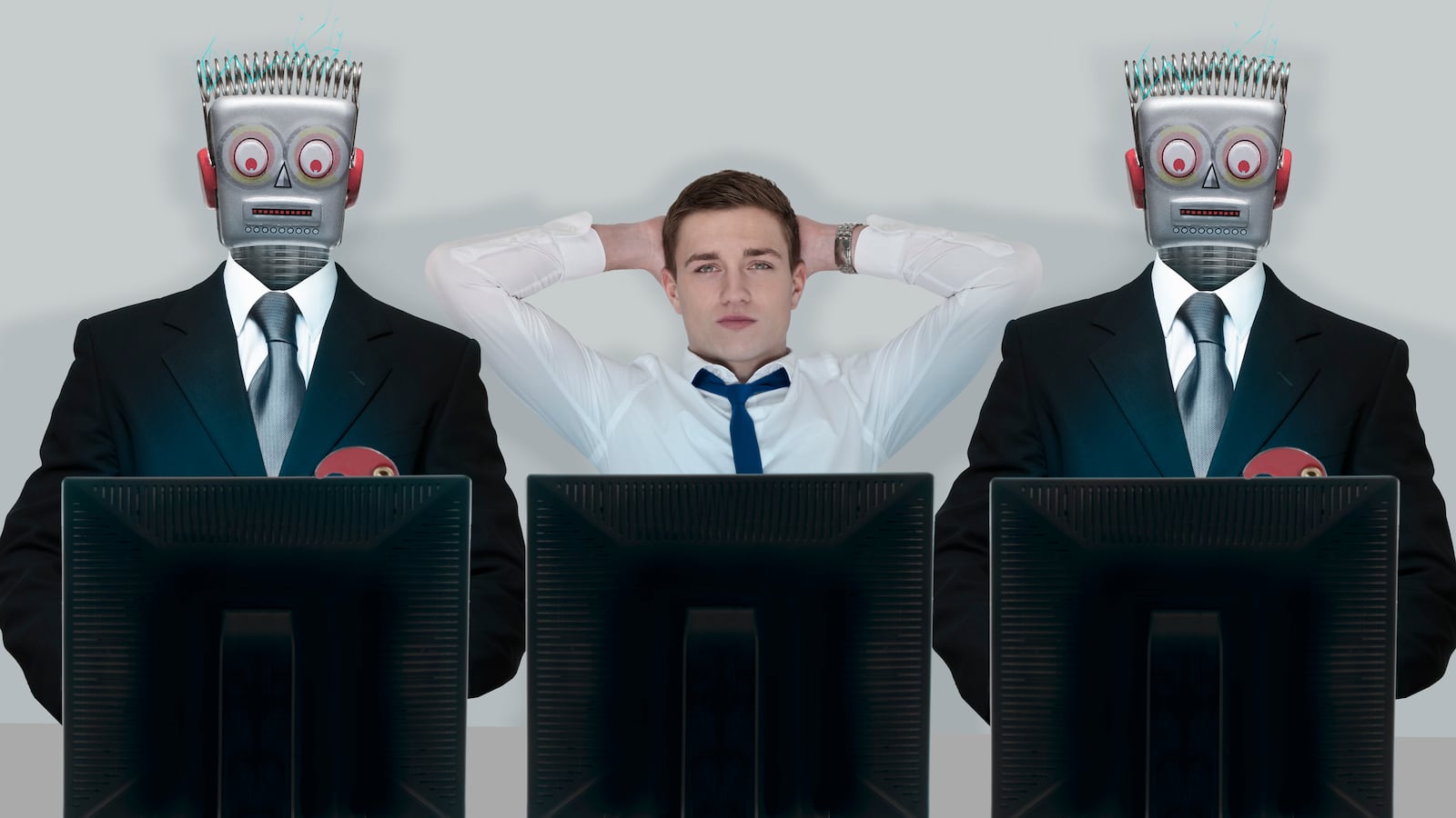 Relaxed businessman between stressed robots