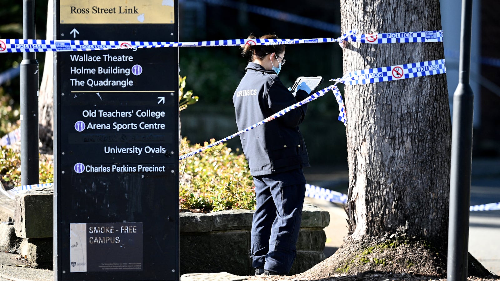 A member of the New South Wales (NSW) law enforcement team works at the scene of an alleged stabbing at the University of Sydney, in Sydney, Australia July 2, 2024.