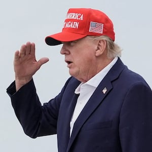 U.S. President Donald Trump salutes after disembarking Air Force One at Joint Base Andrews, Maryland, U.S., August 16, 2026.