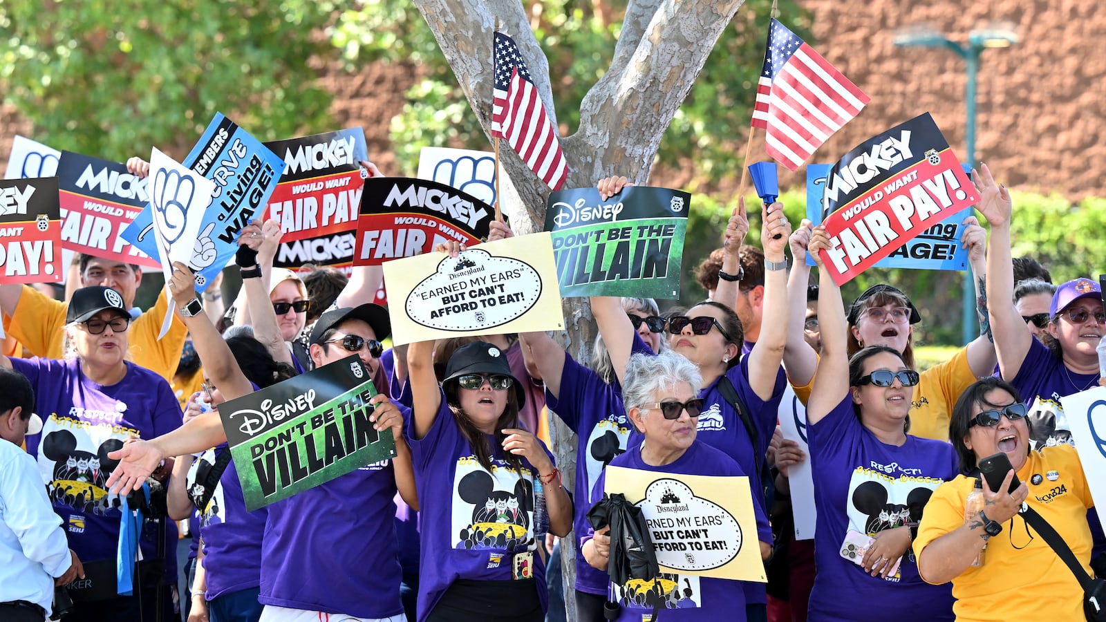 Disney employees rally outside the main entrance of Disneyland Resort in Anaheim, California, on July 17, 2024, ahead of a planned strike authorization vote.