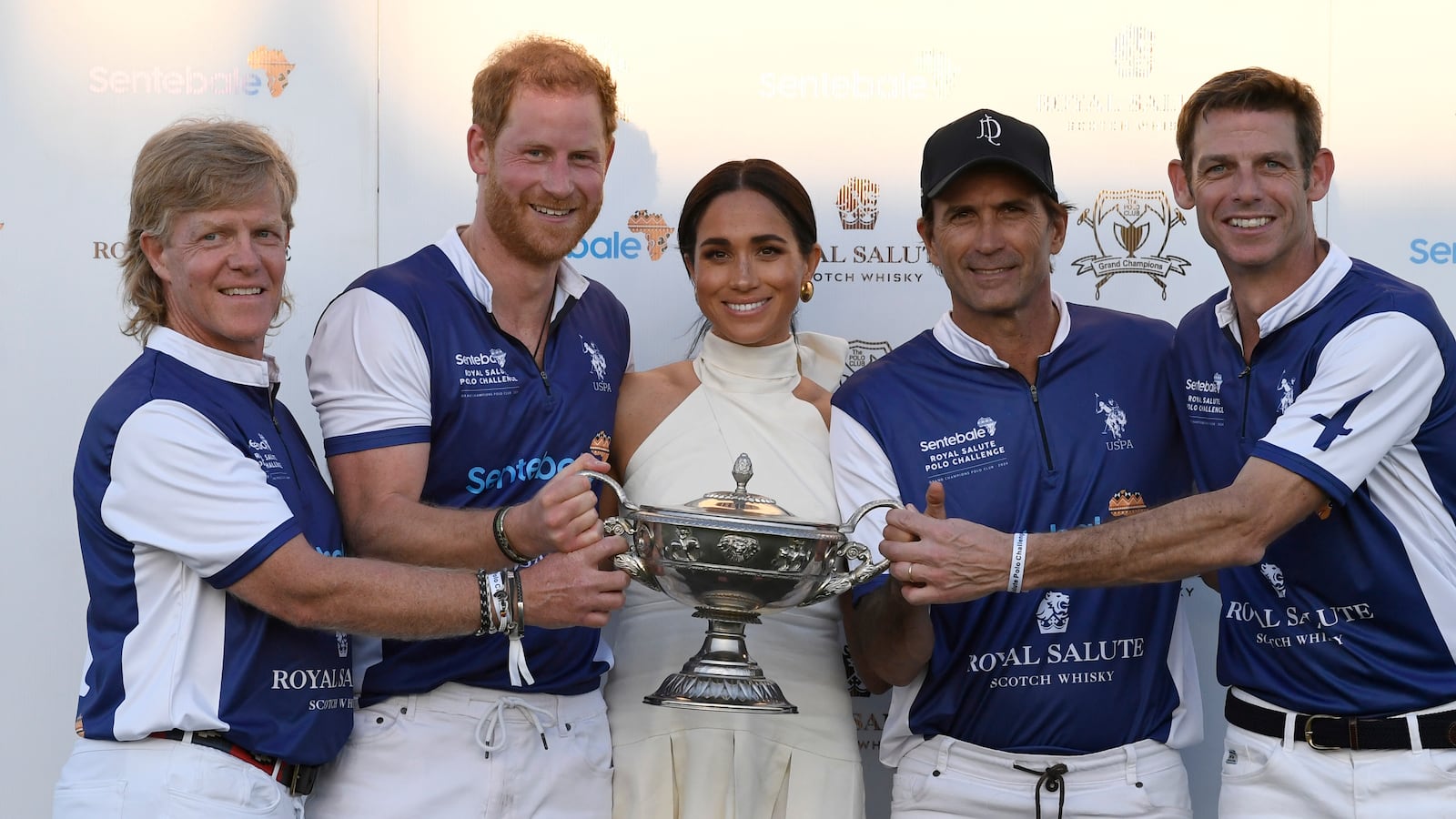 WELLINGTON, FLORIDA - APRIL 12: Dana Barnes, Prince Harry, Duke of Sussex, Meghan, Duchess of Sussex, Adolfo Cambiaso and Malcolm Borwick during the Royal Salute Polo Challenge benefitting Sentebale at Grand Champions Polo Club on April 12, 2024 in Wellington, Florida. The annual Polo Cup has been running since 2010, and to date has raised over £11.4 million to support Sentebale's work with children and young people affected by poverty, inequality and HIV/AIDS in southern Africa.