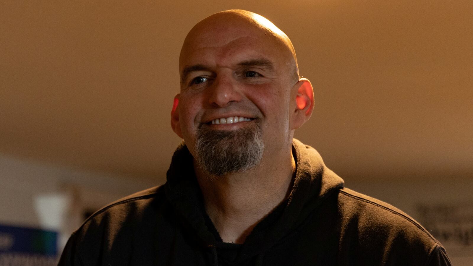 John Fetterman reacts during a campaign stop.