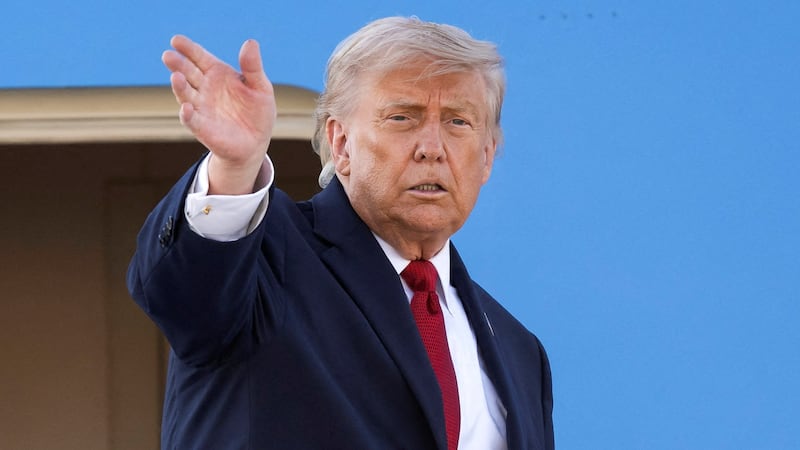U.S. President Donald Trump gestures as he boards Air Force One at Geneva Airport following the G7 summit in nearby Evian (France), in Geneva, Switzerland, June 17, 2026. Martial Trezzini/Pool via REUTERS