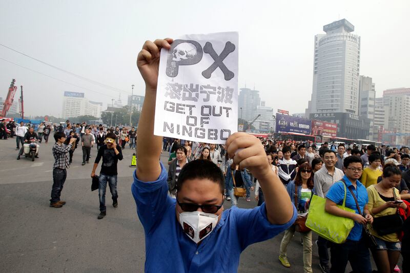 articles/2012/10/29/china-s-green-protest-politics/china-pollution-protesters-levin-tease_z3mq5x