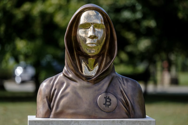 BUDAPEST, HUNGARY - SEPTEMBER 22: A statue of Satoshi Nakamoto, a presumed pseudonym used by the inventor of Bitcoin, is displayed in Graphisoft Park on September 22, 2021 in Budapest, Hungary. The statue's creators, Reka Gergely and Tamas Gilly, used anonymized facial features, as Nakamoto's true identify remains unconfirmed. (Photo by Janos Kummer/Getty Images)