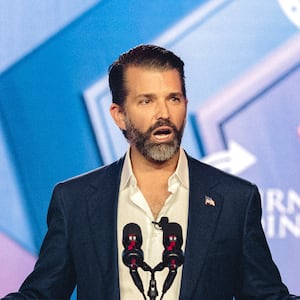 Donald Trump Jr. speaks on stage during Turning Point's annual AmericaFest conference in Phoenix, Arizona on December 21, 2025.