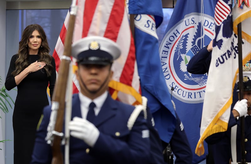 Secretary of Homeland Security Kristi Noem stands for the presentation of colors during a ceremony at the U.S. Coast Guard Headquarters on January 15, 2026 in Washington, D.C.
