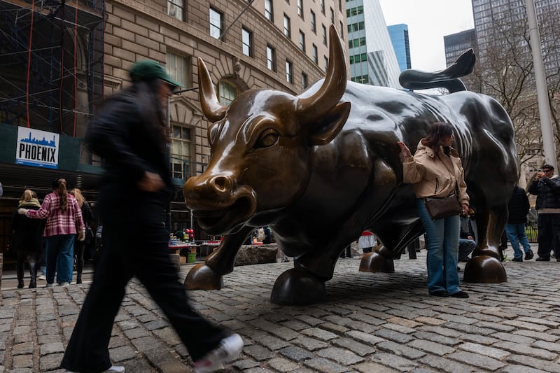 NEW YORK, NEW YORK - MARCH 19: The Wall Street Bull stands in the Financial District, home to the New York Stock Exchange (NYSE), in Manhattan on March 19, 2026, in New York City. Global stocks were down again in trading amid ongoing turmoil in the markets from the war in Iran. The Dow closed down over 200 points. (Photo by Spencer Platt/Getty Images)